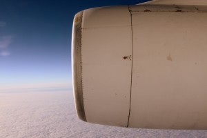 The view of the Antarctic ice and one of the Ilyushin's jet engines out the one small window of the aircraft