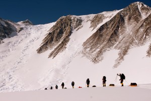 The teams moving to Low Camp with Vinson high above