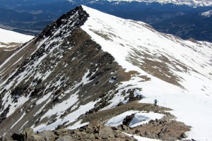 Kristine making her way to Crystal's summit with Peak 10 behind