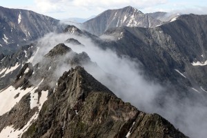 The clouds seeping through the notches in the Drift Peak-Wheeler Mtn ridge