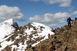 Kristine traversing the ridge to Palomino Point with Grand Traverse Peak behind