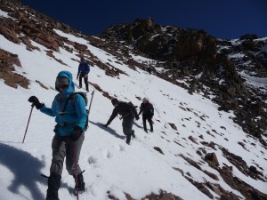 Becky and crew heading down the snowfields below Palomino Point