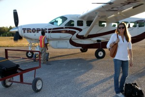 Kristine and our small plane after landing on Caye Caulker