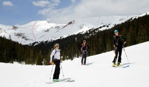 Kristine, Mike, & Shawn on the ski out Herman Gulch with our route up/down Pettingell's southeast face in red behind