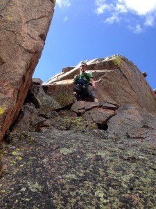 Me at the top of the low 5th class hand-jam crux
