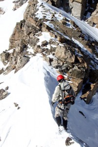 Jesse crossing a knife-edge snow ridge
