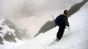 J beginning the descent down the southwest couloir as a storm engulfed us