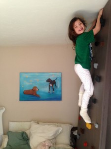 Harper climbing on Sawyer's climbing wall