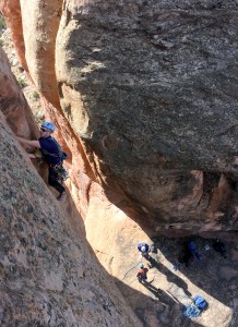 Dylan climbing pitch 1 of Fast Draw with the J/Stevo team below