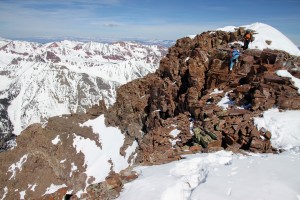 J and Natalie downclimbing the summit ridge